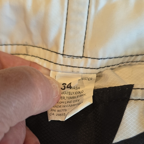 O'Neill Black and Red Board Shorts with Geometric Design - Picture 2 of 4